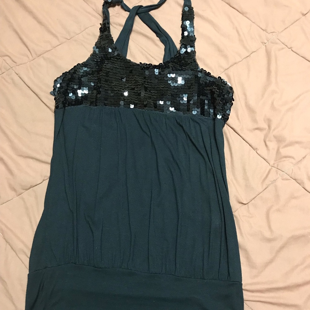 Black shirt with sequin at the top.